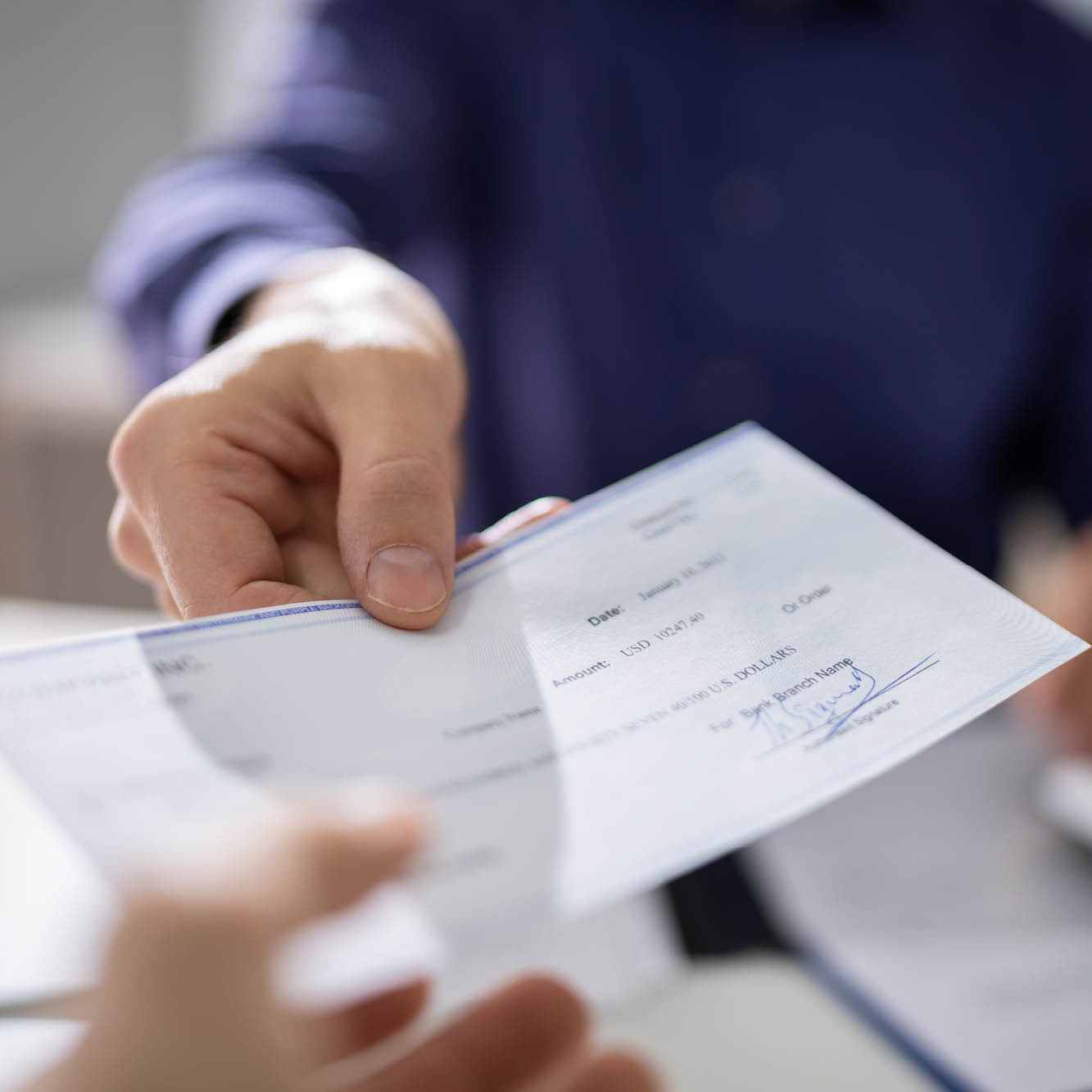 handing over a check
