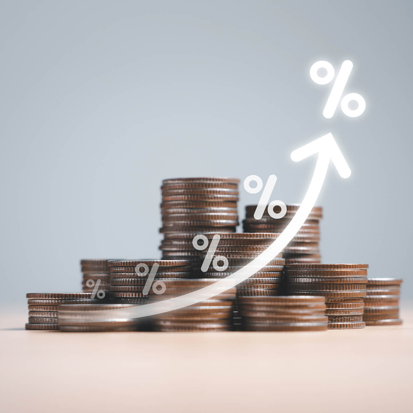 stack of quarters with arrow showing increase in percentage